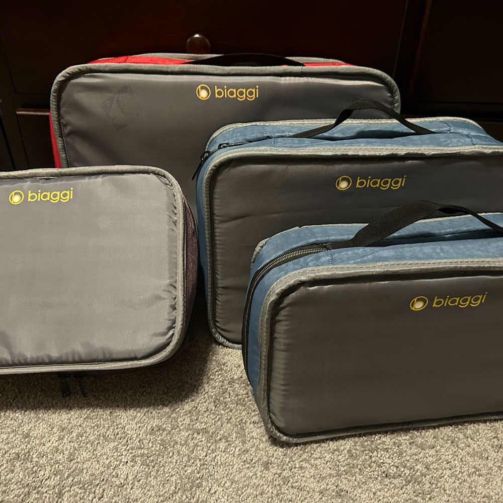 Three Biaggi suitcases. Red31”, Blue24”, and Purple 21”. SOLD